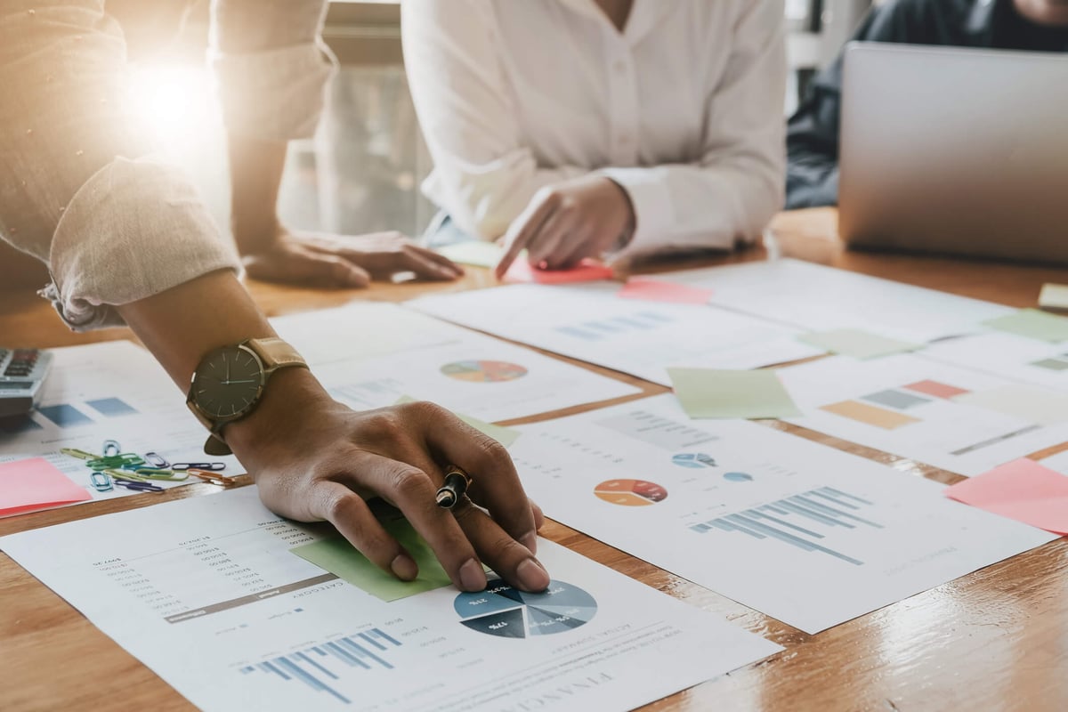 HR Analytics-hands with graphs on table