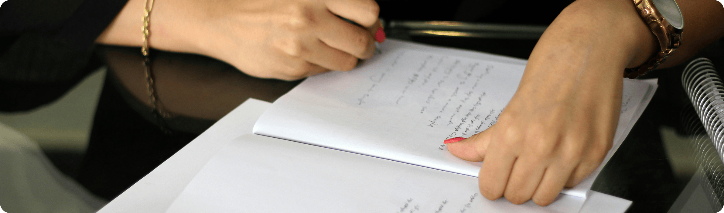 Woman writing on a financial document