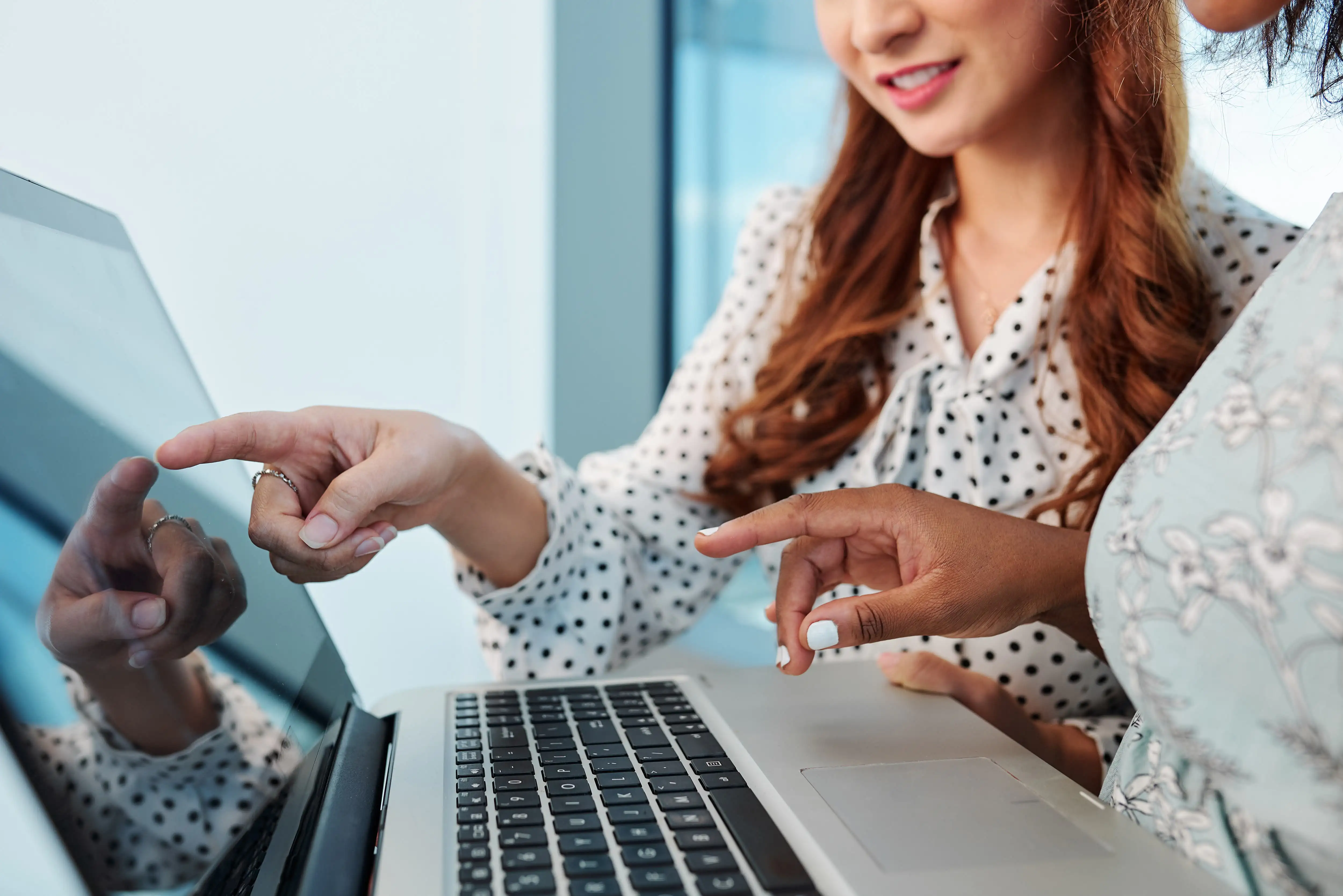 female-managers-discussing-project-details-2023-11-27-05-17-45-utc